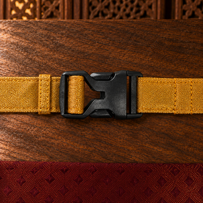 Close-up of the gold woven neck strap and black side-release buckle on FurJeevan’s Maroon & Gold Ethnic Dog Bandana.